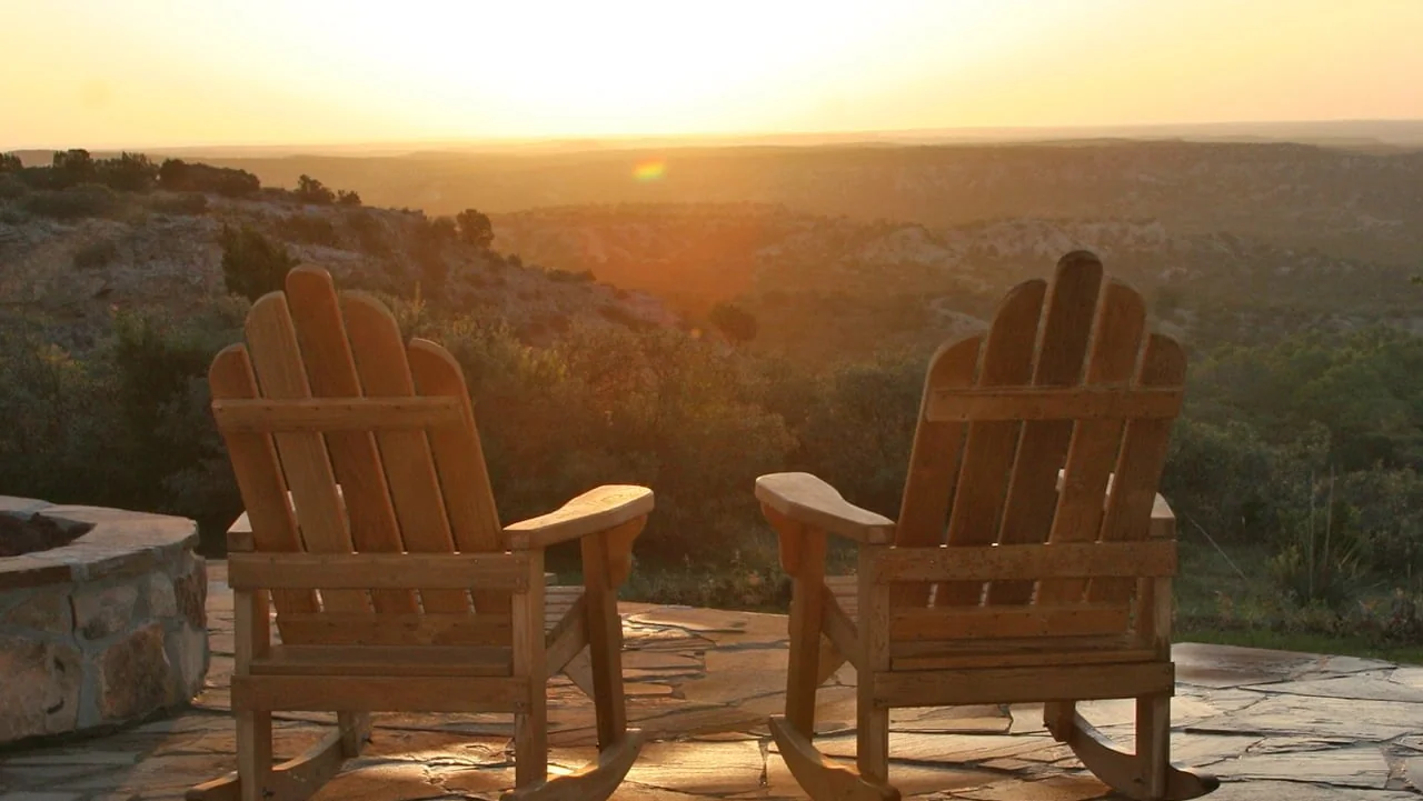 Outdoor seating overlooking the landscape at The Hideaway Experience’s Texas location.