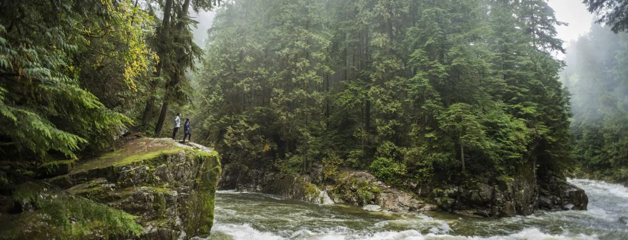 Two people walking in nature in recovery using wilderness therapy