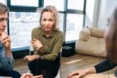 Female counselor working with youth and teenagers on mental health