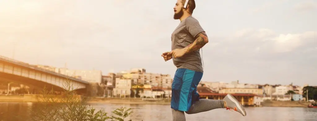 Man running beside a river