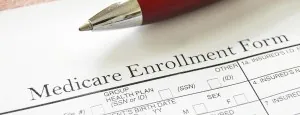 Medicare enrollment form and pen