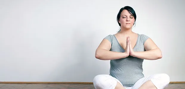 Woman sitting in a yoga pose
