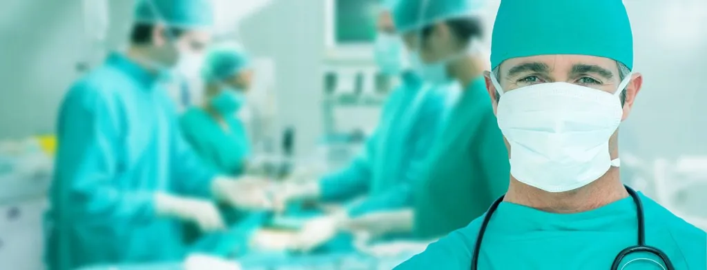 Medical professional wearing a mask and surgical cap