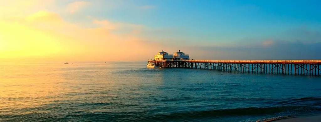 Pier on the Malibu coastline at sunset