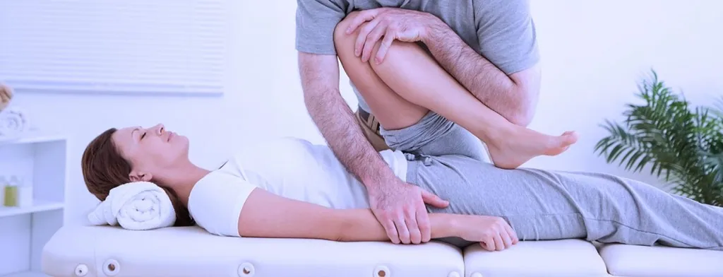 Woman worked on by chiropractor