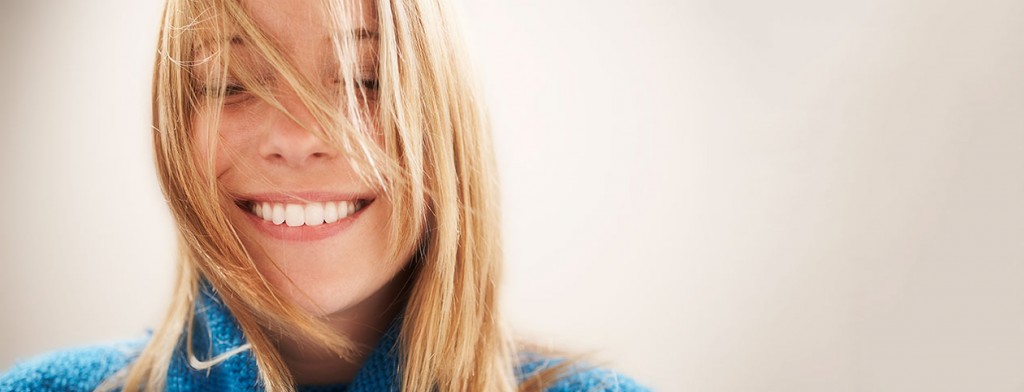 Happy woman with eyes closed avoiding depression