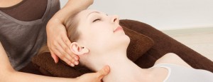Massage a young woman, chiropractic sinus adjustment