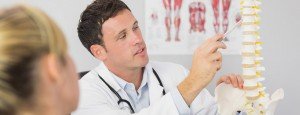Chiropractor walking patient through popular chiropractic techniques