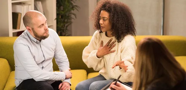 Couple seated in a counseling session