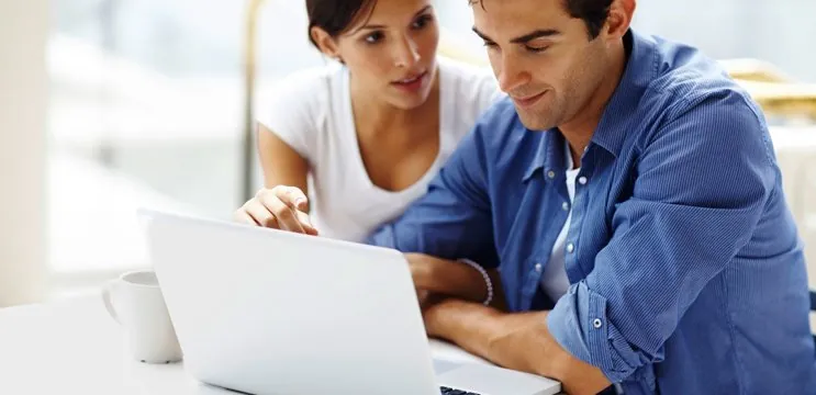 Couple looking at a laptop
