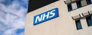 NHS sign on a building