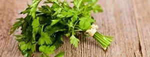 Fresh parsley on a wooden surface
