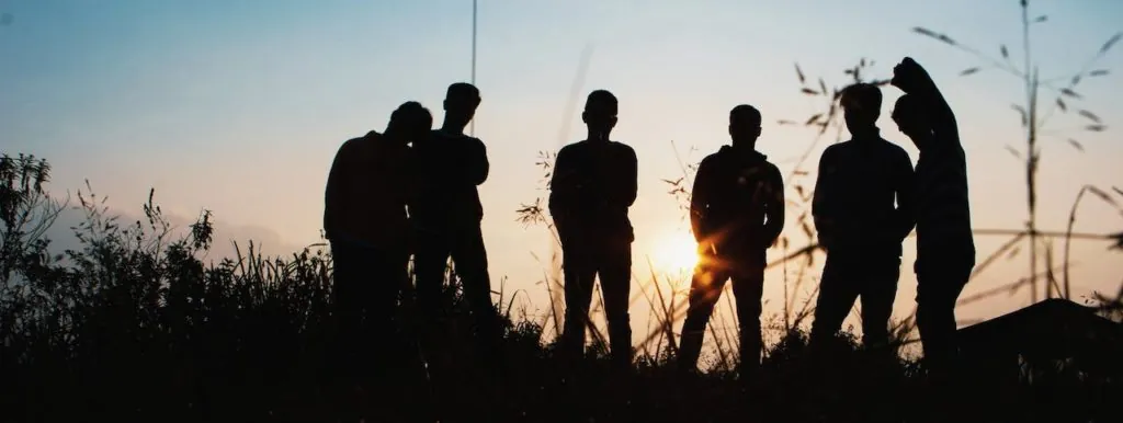 Silhouettes of a group at sunset