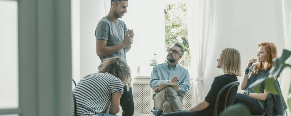 People seated in a group counseling session