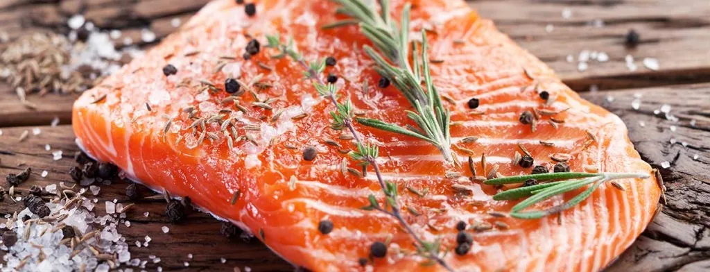 Salmon fillets seasoned with herbs and pepper