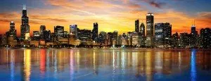 Chicago skyline reflected in the water at sunset