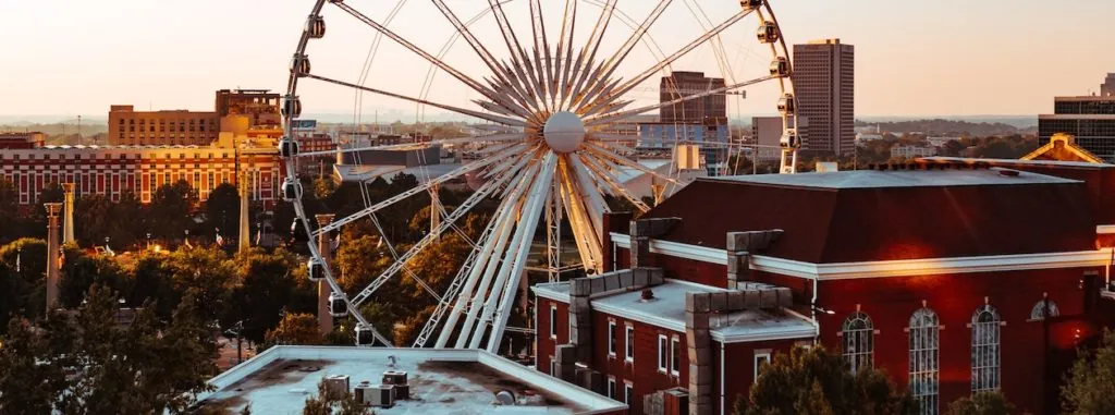 Ferris wheel and city buildings in Atlanta