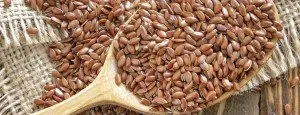 Flax seeds in a wooden spoon