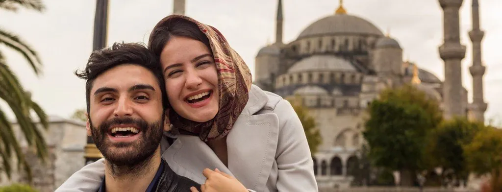 Couple standing in front of a domed building