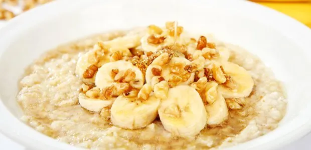 Bowl of cereal topped with banana slices