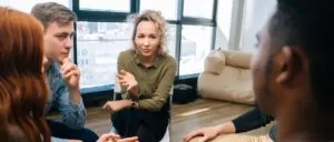 Counselor speaking with a group of young people