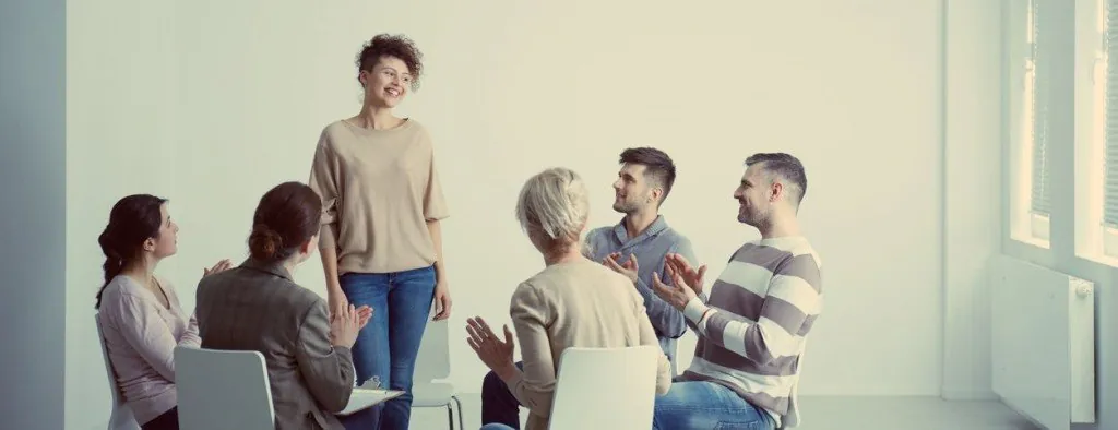 People seated in a group discussion