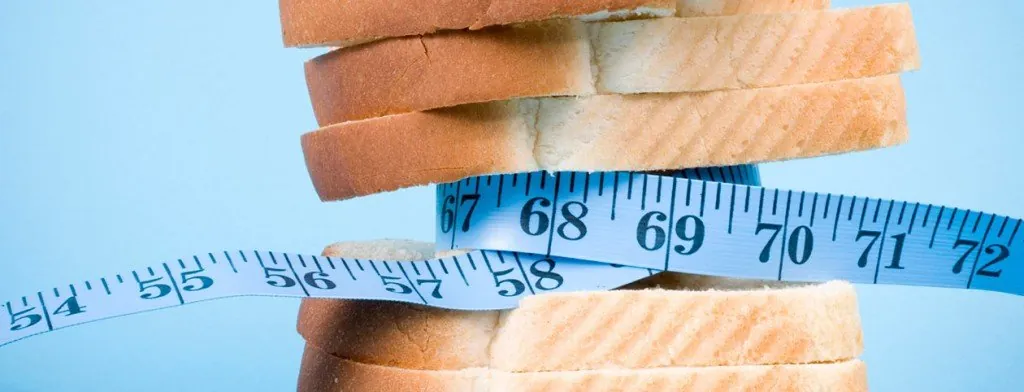 Measuring tape wrapped around stacked slices of bread