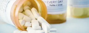 Tablets spilling from a prescription bottle