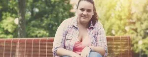 Young woman sitting on a park bench