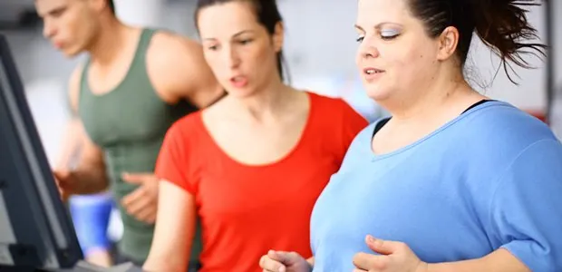 Group exercising together indoors