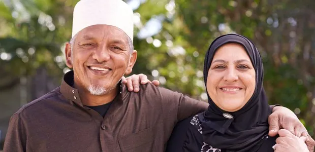 Older couple smiling outdoors