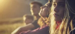 Young person sitting outdoors