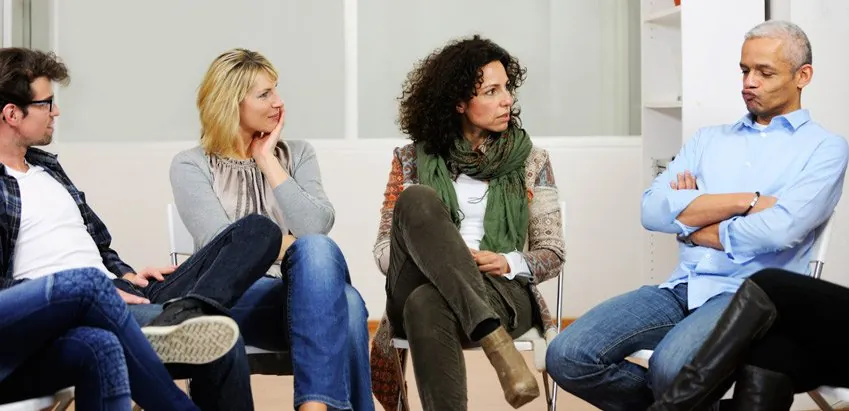 People seated in a counseling group