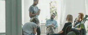People seated in a group counseling session
