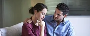Couple sitting together during a serious conversation