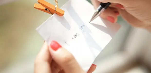 Handwritten note held with a small clothespin
