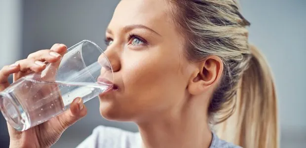 Woman drinking a glass of water