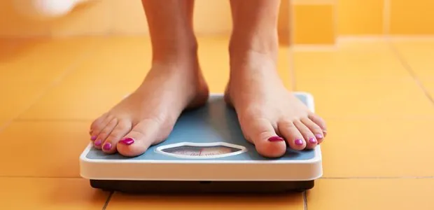 Person standing on a bathroom scale