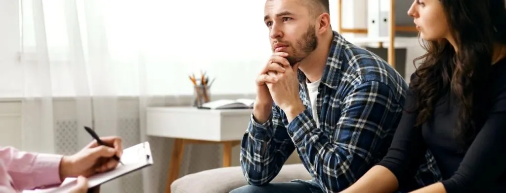 Couple speaking with a counselor