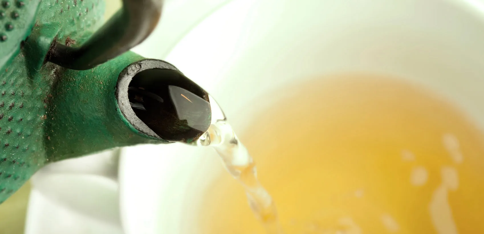 Tea being poured into a cup