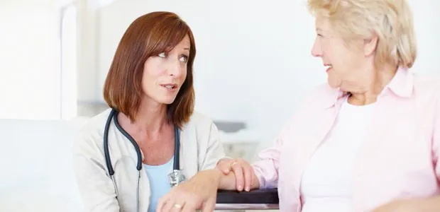 Clinician speaking with an older woman