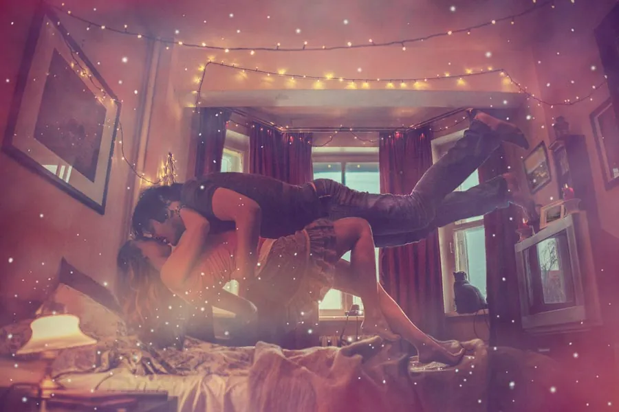 Illustration of a couple floating above a bed